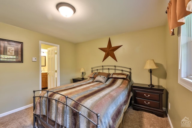 carpeted bedroom with ensuite bathroom