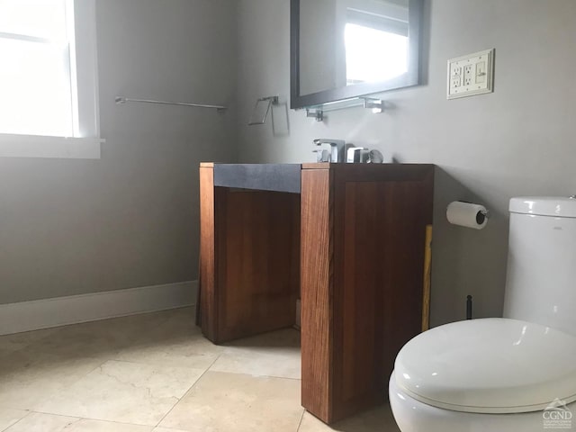 bathroom featuring tile patterned flooring and toilet