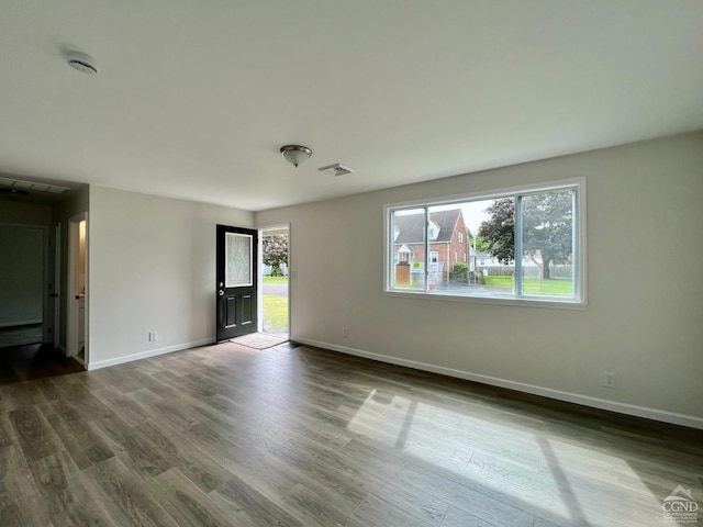 unfurnished room featuring hardwood / wood-style flooring