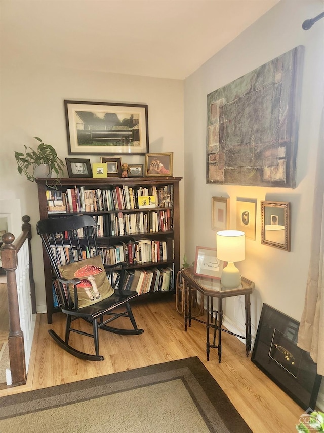 sitting room featuring wood finished floors