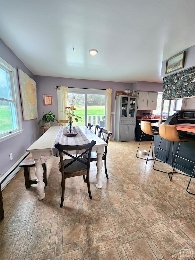 dining area with baseboard heating