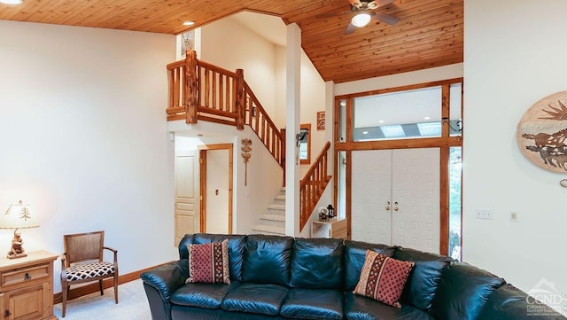 living room with carpet, ceiling fan, lofted ceiling, and wooden ceiling