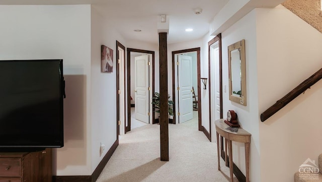 hallway with light colored carpet