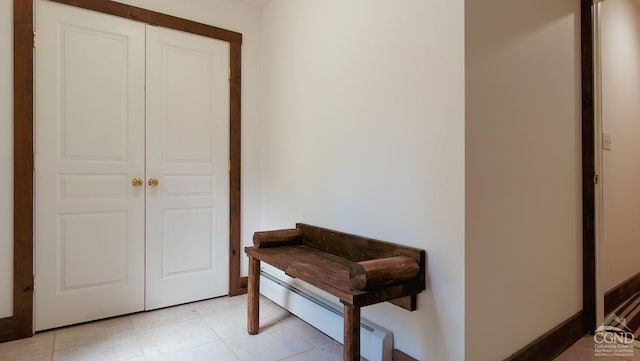 hallway featuring light tile patterned floors