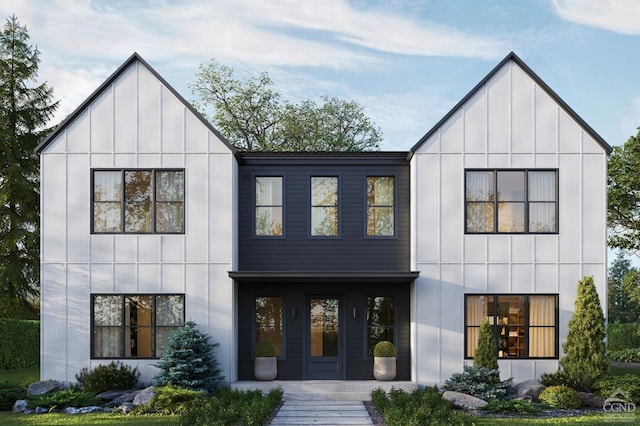 modern inspired farmhouse with a porch and board and batten siding