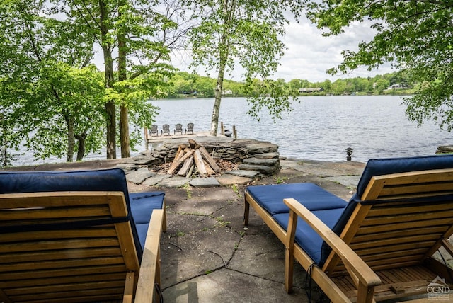 view of patio / terrace with a dock and a water view