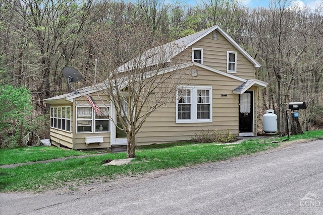 view of front of property with a sunroom