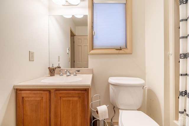 bathroom with vanity and toilet