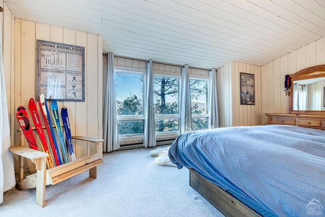 bedroom with carpet floors and wooden walls