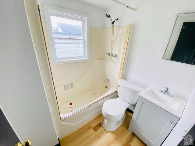 full bathroom featuring toilet, vanity, bathtub / shower combination, and hardwood / wood-style flooring