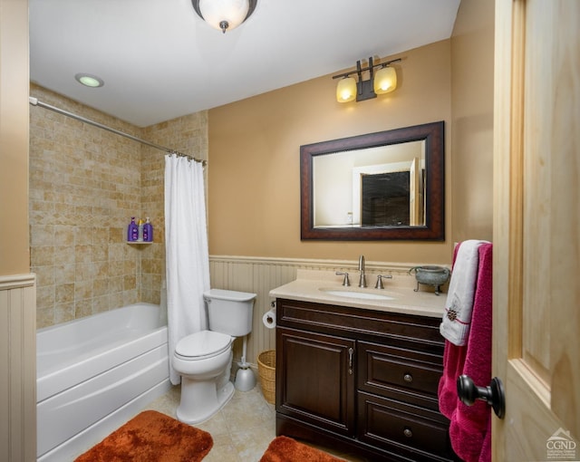 full bathroom featuring vanity, tile patterned floors, toilet, and shower / bath combo with shower curtain