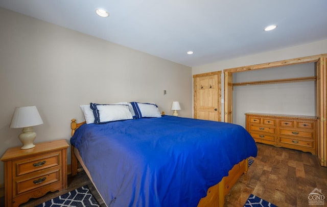 bedroom featuring dark hardwood / wood-style flooring