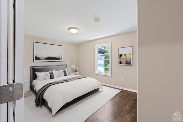 bedroom with hardwood / wood-style floors