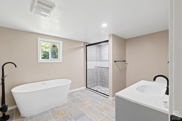 bathroom featuring plus walk in shower and vanity