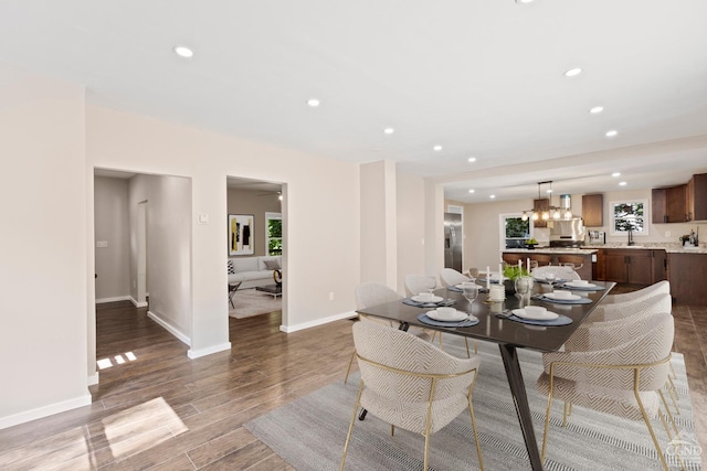 dining area with dark hardwood / wood-style flooring