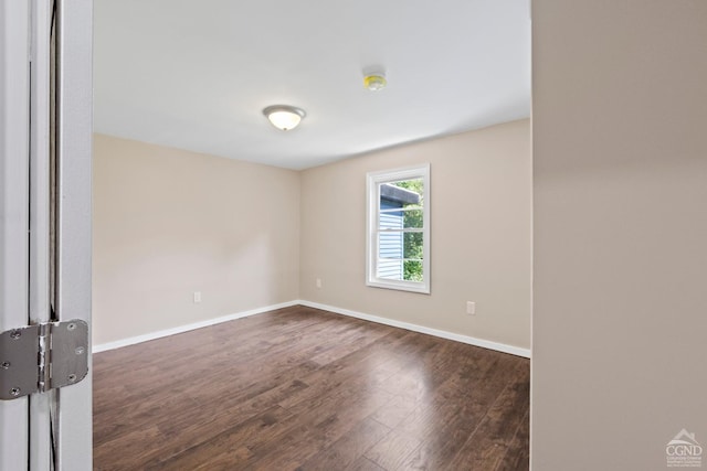 empty room featuring dark hardwood / wood-style floors