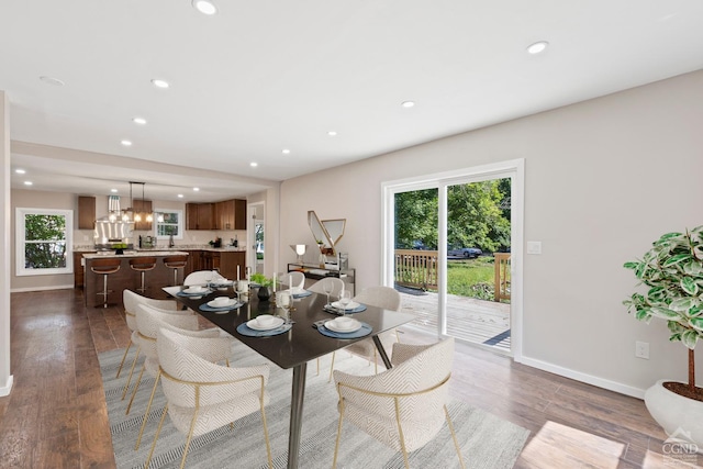 dining room featuring dark hardwood / wood-style flooring and a chandelier