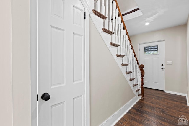 foyer with dark hardwood / wood-style floors