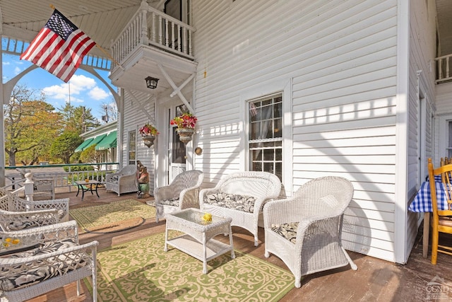 view of patio featuring a balcony