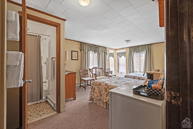 bedroom featuring light carpet and baseboard heating