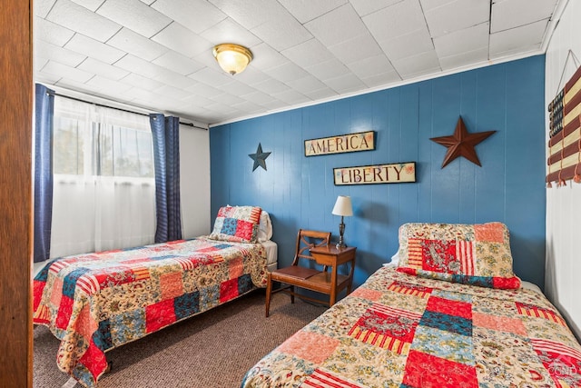 bedroom featuring dark carpet