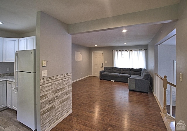 living room featuring dark hardwood / wood-style flooring