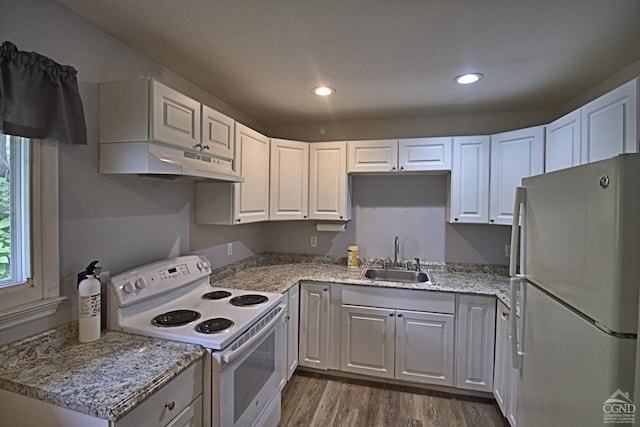 kitchen featuring stainless steel refrigerator, white cabinetry, electric range, sink, and dark hardwood / wood-style flooring