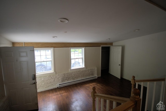 foyer featuring dark hardwood / wood-style floors and a baseboard heating unit