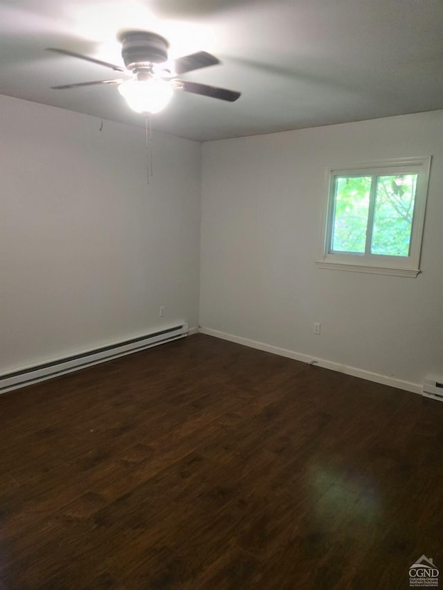 unfurnished room with ceiling fan, baseboard heating, and dark wood-type flooring