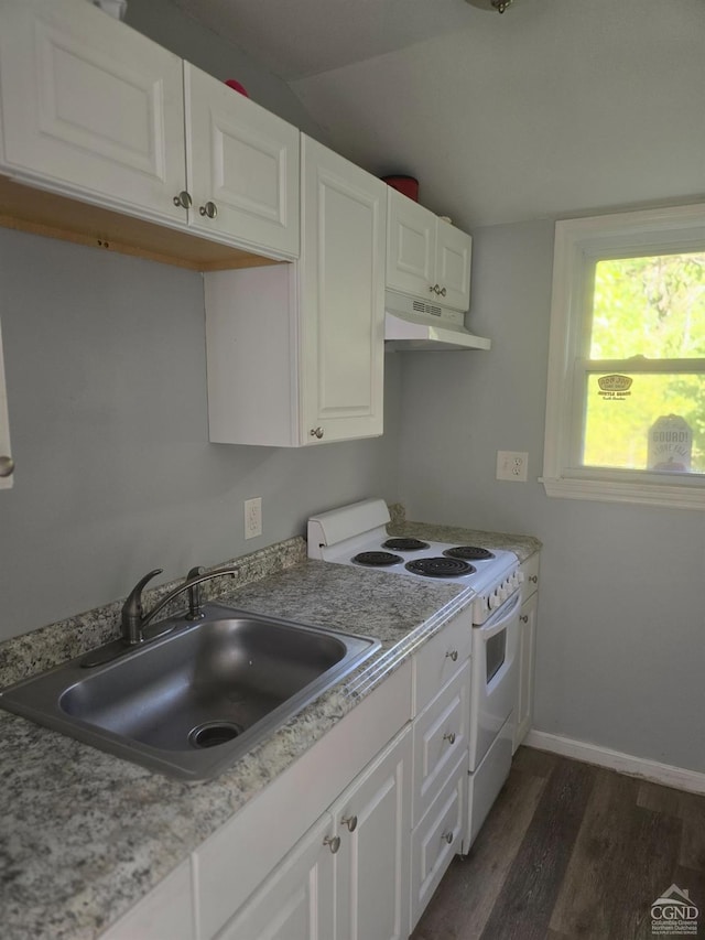 kitchen featuring white range with electric cooktop, white cabinetry, and sink