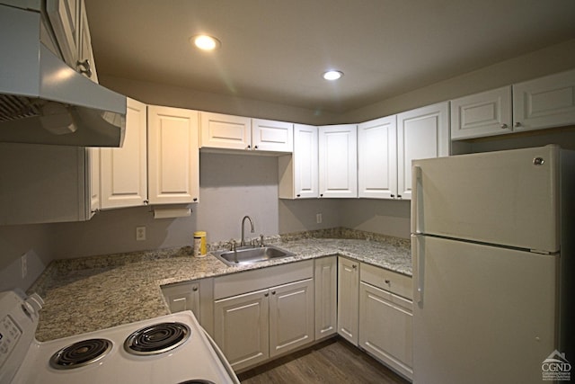 kitchen featuring stove, white refrigerator, sink, dark hardwood / wood-style floors, and white cabinetry