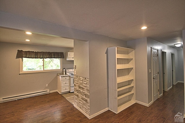 hall featuring a baseboard radiator and dark hardwood / wood-style floors