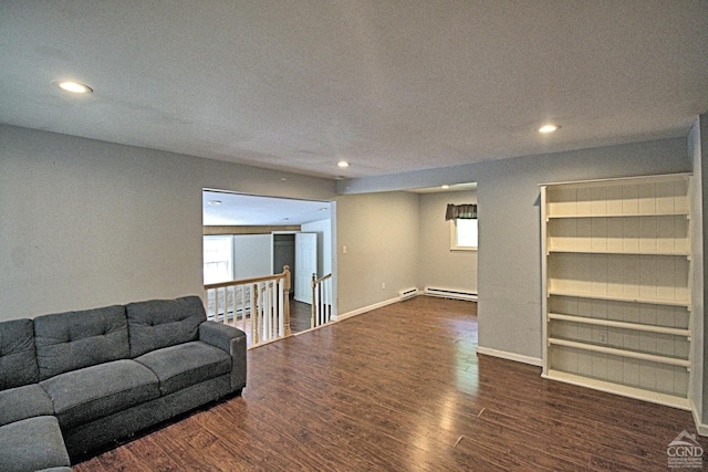 living room with a textured ceiling, a baseboard radiator, and dark wood-type flooring