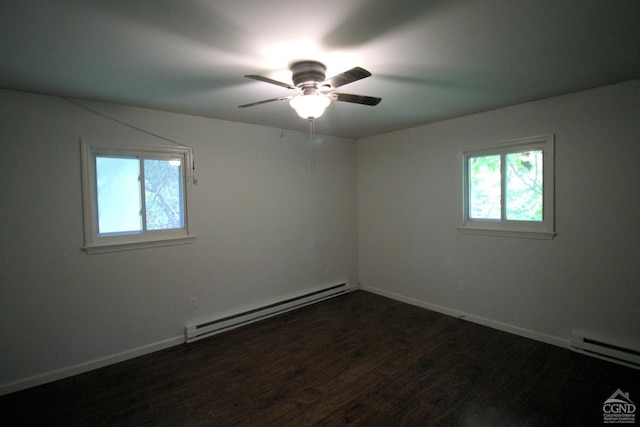 spare room featuring dark hardwood / wood-style flooring, ceiling fan, plenty of natural light, and a baseboard radiator