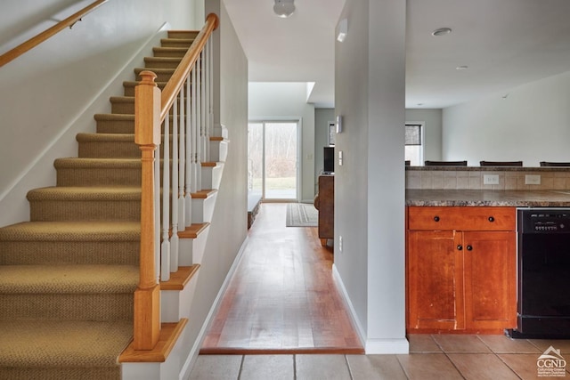 stairway with tile patterned flooring
