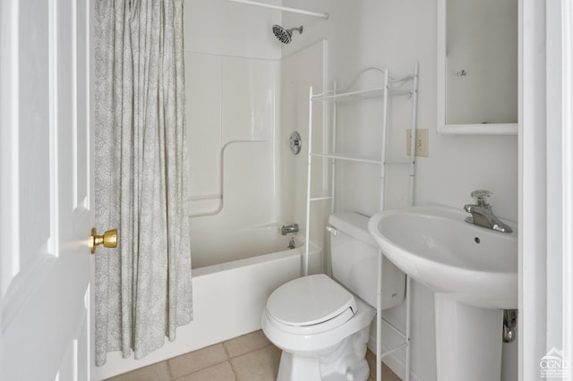 bathroom featuring tile patterned floors, shower / tub combo, and toilet