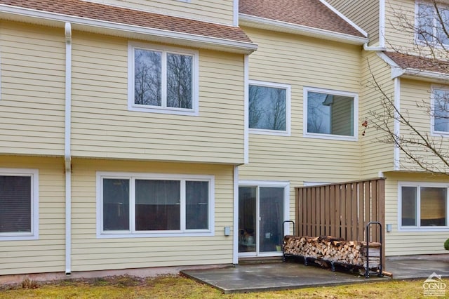 back of property featuring a patio