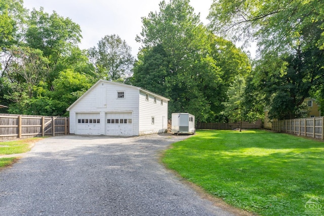 garage with a yard