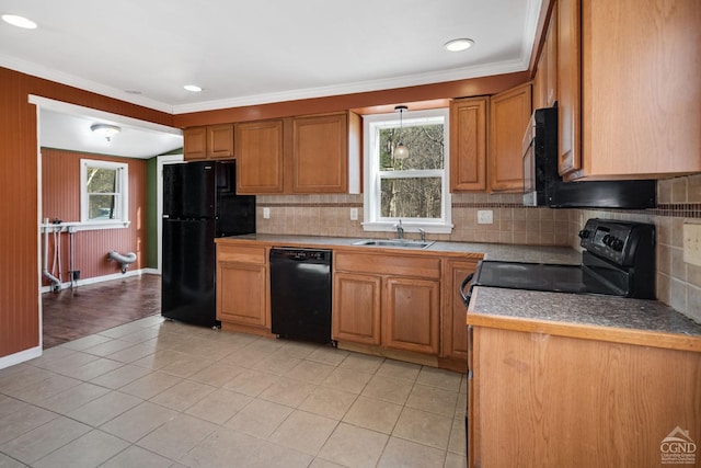 kitchen featuring black appliances, sink, decorative backsplash, ornamental molding, and light tile patterned floors