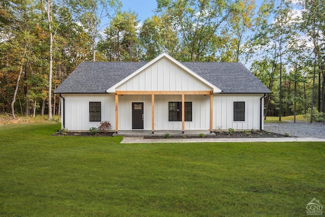 modern farmhouse style home with a porch and a front yard