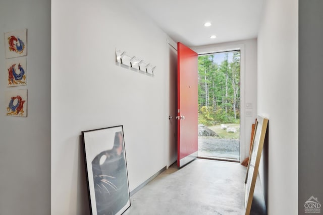 entryway with concrete floors and recessed lighting