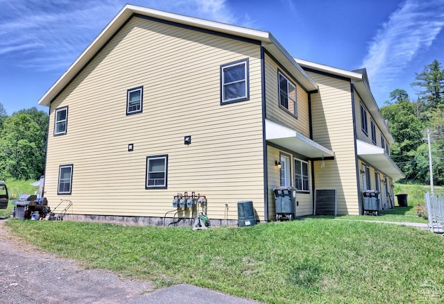 view of home's exterior featuring a yard