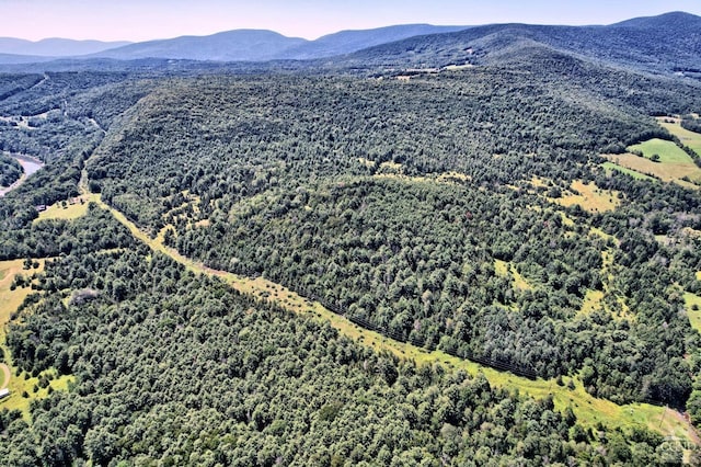 aerial view at dusk featuring a mountain view