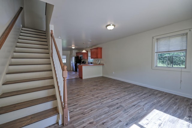 staircase featuring hardwood / wood-style flooring