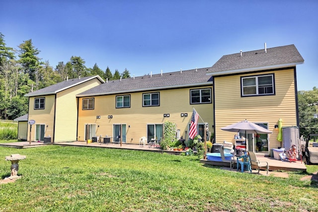 back of house with a yard