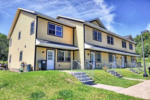 view of front facade featuring a porch and a front yard