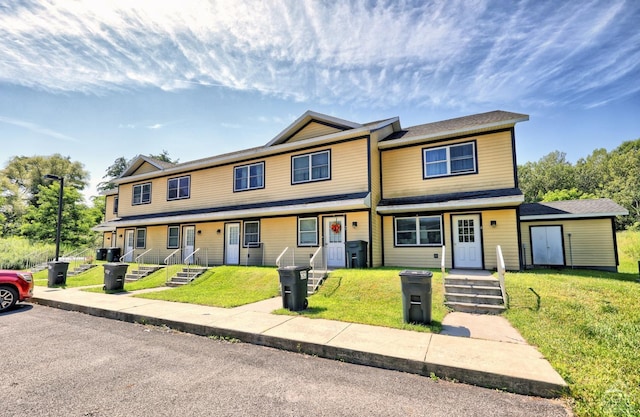 view of front of home with a front lawn