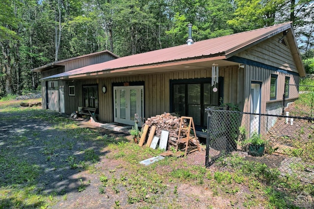 back of house featuring french doors and a porch