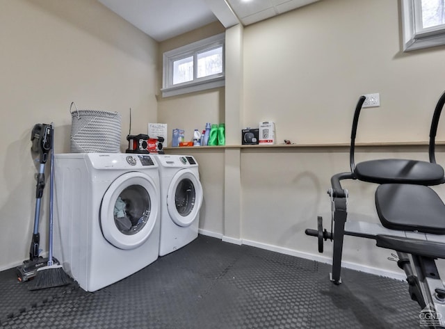 washroom featuring washer and clothes dryer