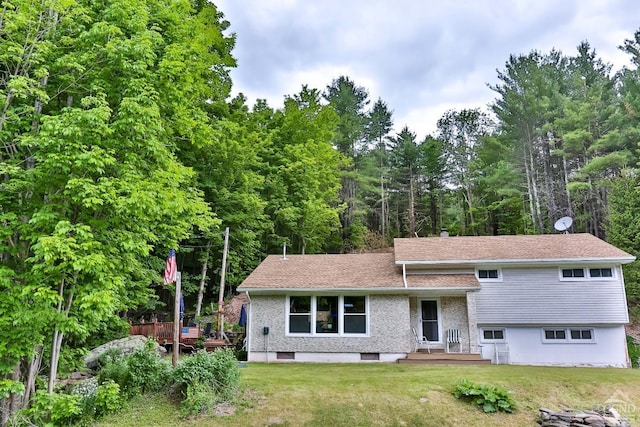 split level home with a front yard